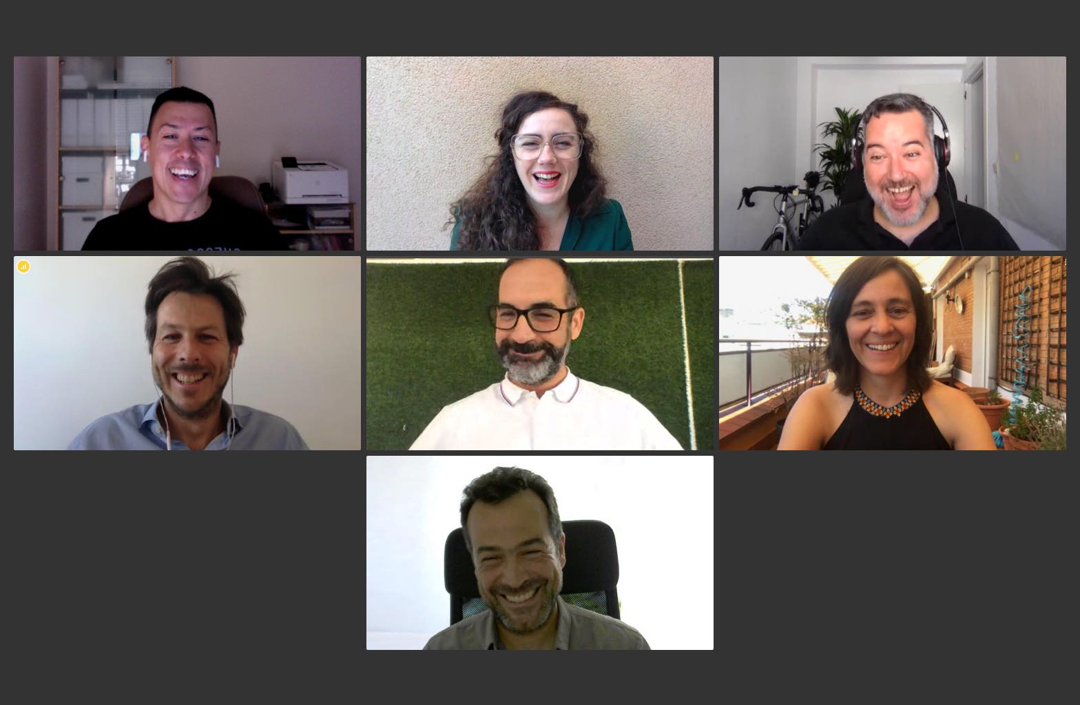 Videoconference with all members of the ilios team, all laughing.